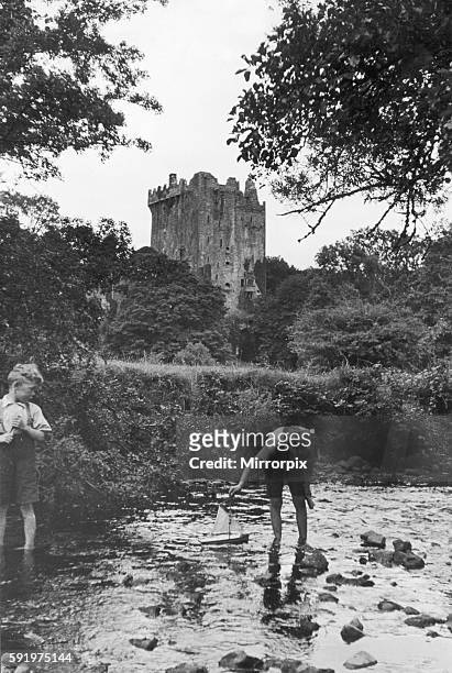 Two boys playing in the stream below Blarney Castle. 24th September 1935