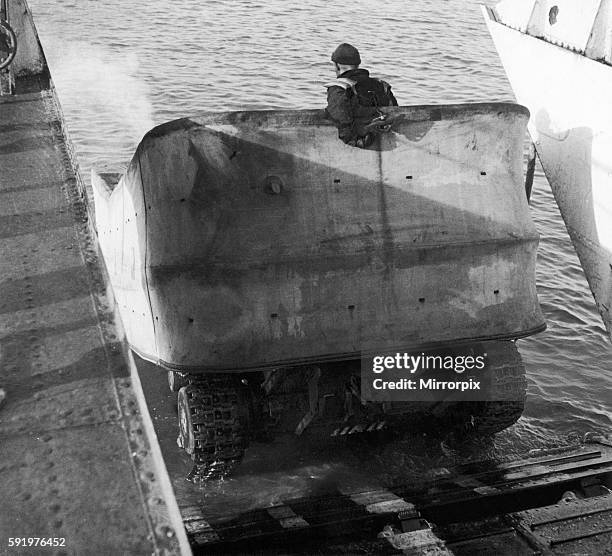 Valentine DD Swimming tanks leave the ramp of a landing craft and enter the sea about 3000 yards from shore during a training exercise ahead of the...