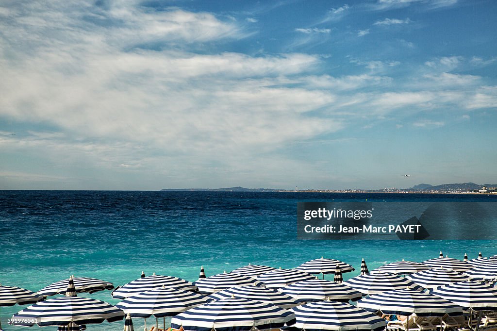 Beach Umbrellas on beach of the city of Nice