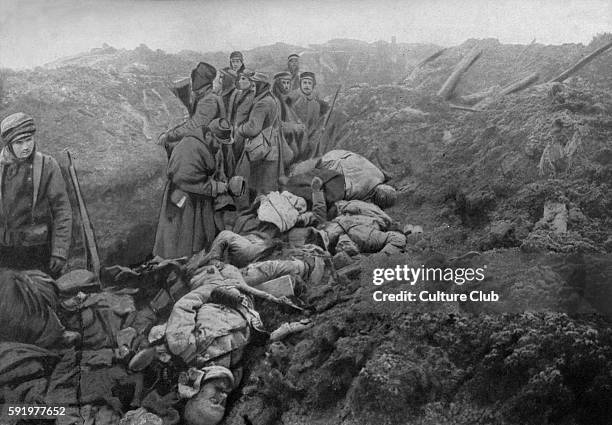 Captured German trenches at Les Eparges. Photo shows dead German soldiers about to be collected and buried.