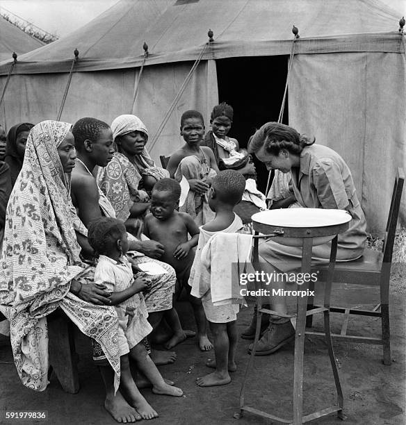East African groundnuts scheme. Open air hospital at Kongwa - Sister Helen Porter with native mothers and babies. May 1952 O15017-001