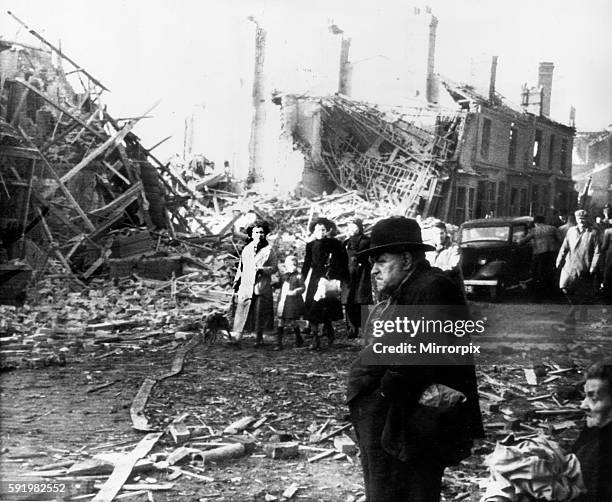 15th November 1940 Survivors from the previous nights bombing seen here walking through the wreckage of Coventry city centre. 15th November 1940. The...