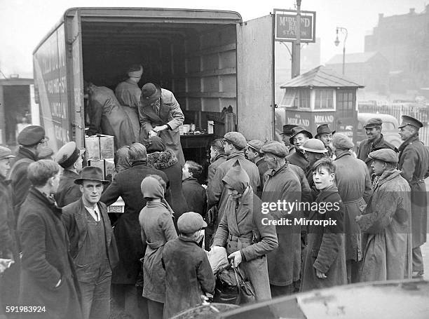 Birmingham Blitz 1940 People buying rationed goods from the back of van parked in the Midland Red bus station at Pool Meadow, Coventry. 18th November...