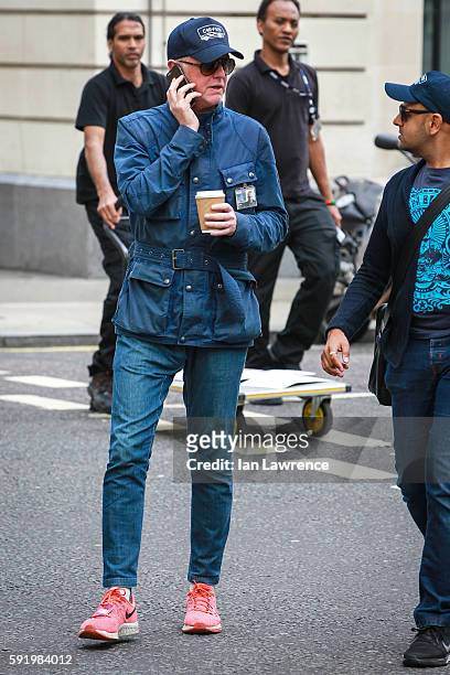 Chris Evans seen on the phone as he leaves BBC Radio Two studios on August 18, 2016 in London, England.