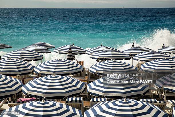 umbrellas on the beach in nice - jean marc payet stockfoto's en -beelden