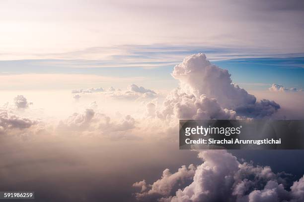heavenly scene above the clouds - wolkengebilde stock-fotos und bilder