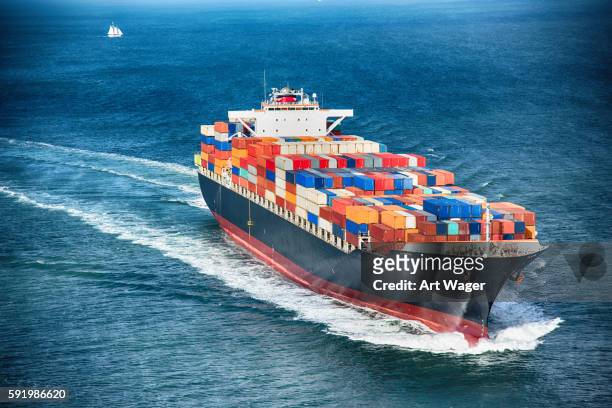 generic cargo container ship at sea - container stock pictures, royalty-free photos & images