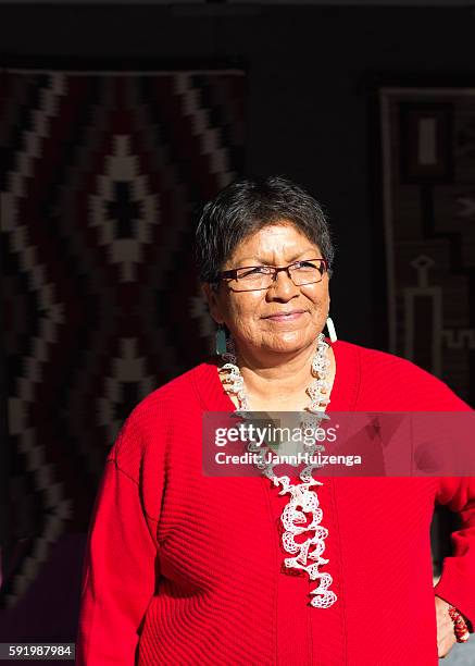 navajo-dine weaver at the 2016 santa fe indian market - puebloan culture stock pictures, royalty-free photos & images