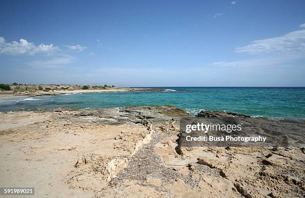 rocky beach in porto palo, sicily - portopalo di capo passero stock pictures, royalty-free photos & images