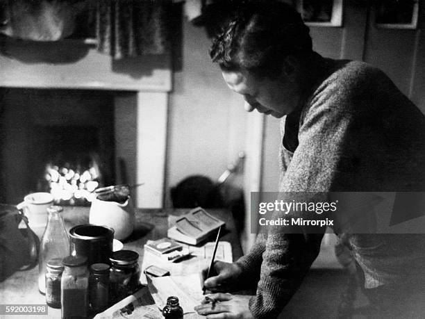 Poet Dylan Thomas pictured at his flat in Chelsea, London, 1945.