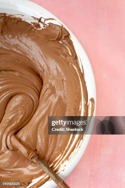 close up of bowl of chocolate batter - chocolate swirl from above stock pictures, royalty-free photos & images