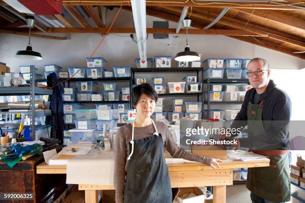 entrepreneurs working in workshop - business mature couple portrait bildbanksfoton och bilder