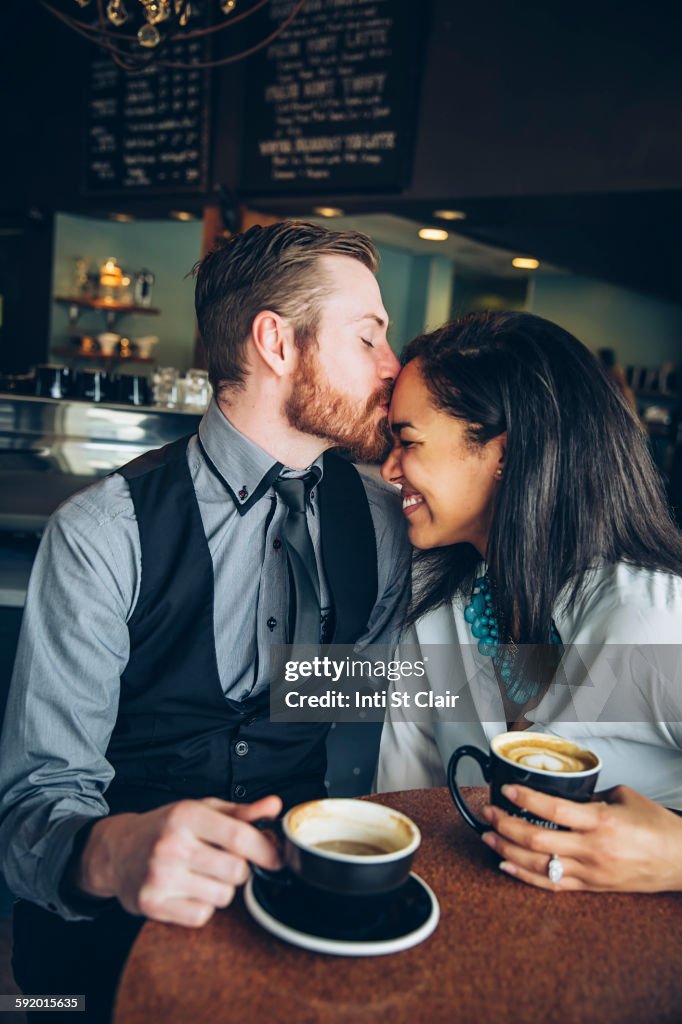 Couple drinking coffee in cafe