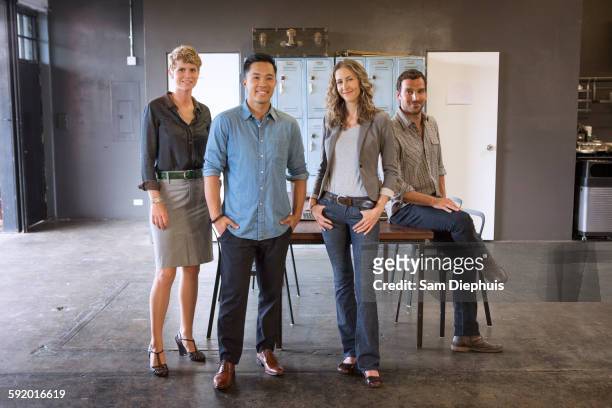 business people smiling in office - position physique photos et images de collection