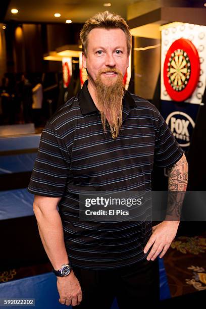 Simon Whitlock poses for a portrait during the launch of the The World Series of Darts returns to Sydney in the 2016 Ladbrokes Sydney Darts Masters...