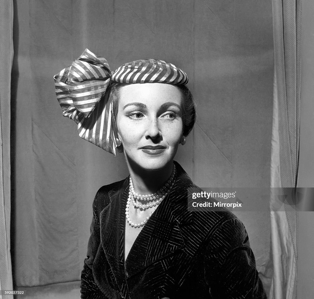 Clothing Hats: Norman Hartnell presents his autumn collection of hats. They are without exceptions small streamlined cre