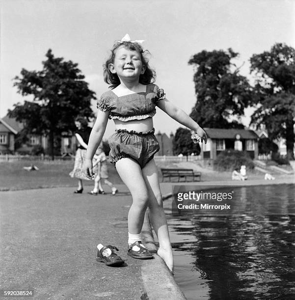 Holidays, little girl modelling swimsuit. June 1953 D3299-008