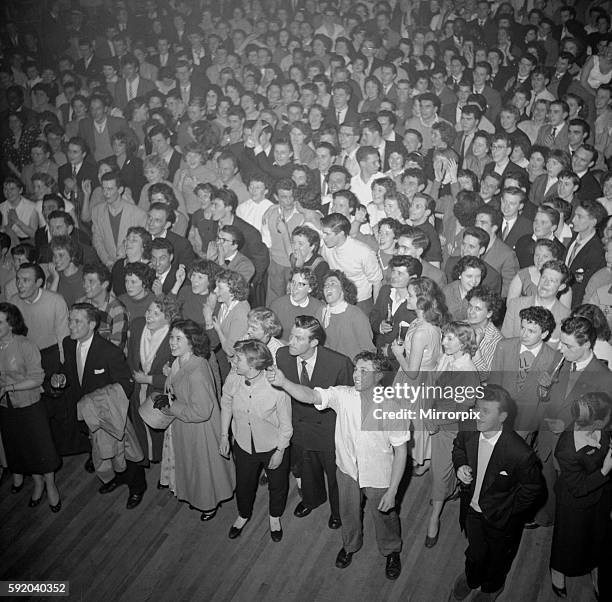 Crowds of teenagers at Hammersmith in London, ready to hear rock n roll singer Bill Haley perform with his band the Comets February 1957