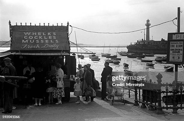 Congress 1952 Delegates from the TUC congress stroll down to the Whelks, Cockles and Mussel stall by the harbour wall in Margate for some jellied...