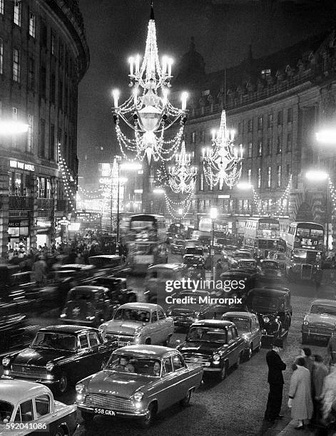 Regent Street packed with traffic as new Christmas lights in the form of chandeliers hanging from the middle of the street are turned on. 26th...