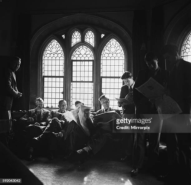 Students of Oxford University relaxing in the common room of one of the colleges. Circa 1950.