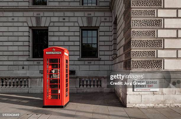 red telephone box - telephone booth stock pictures, royalty-free photos & images