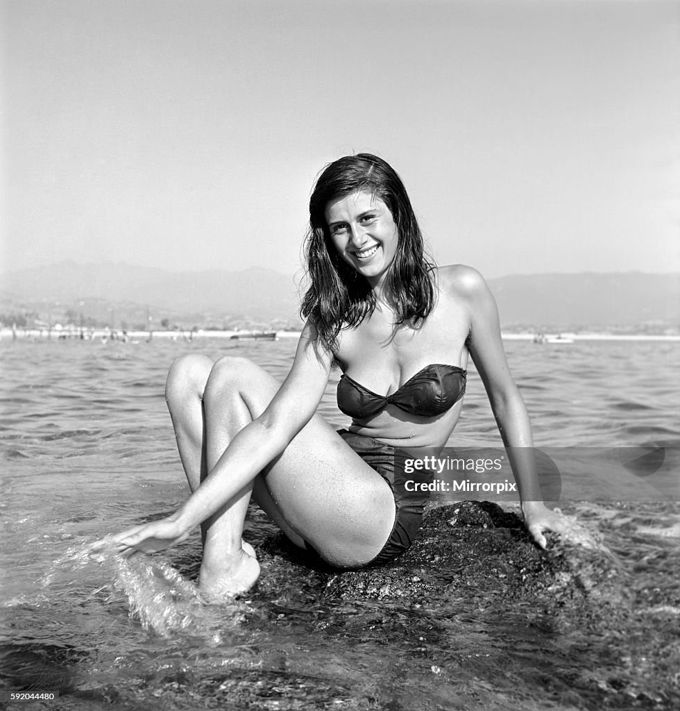 Clothing: Fashion: Beachwear: Holidaymakers: Bathing: Beauties seen here cooling off in the sea in Corsica. August 1957