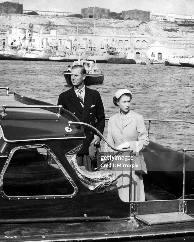 Queen Elizabeth II and Prince Philip leave Malta harbour to go aboard the Royal Yatch Britannia during the Royal Tour of