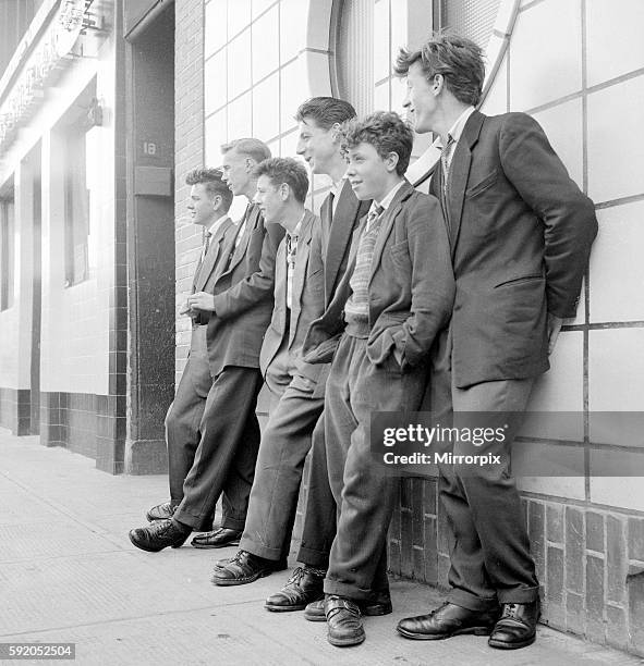 Teenage boys seen here leaning against the wall of the local coffee bar in Govan, Glasgow. September 1956