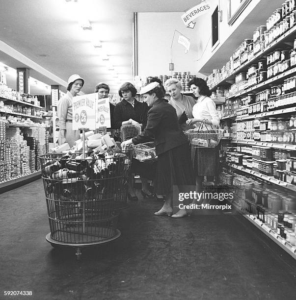 Housewives in search of a bargin at the Premier supermarket in North Finchley. 20th June 1959