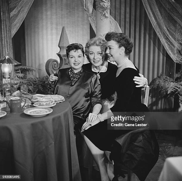 Portrait of American actresses, from left, Judy Garland , Greer Garson , and Jane Wyman as they pose together at the 27th Academy Award nominations...