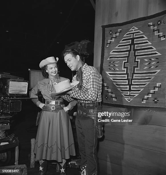 Portrait of married American entertainers Dale Evans and Roy Rogers during the filming of the NBC television program, 'Hollywood vs TV,' February 2,...