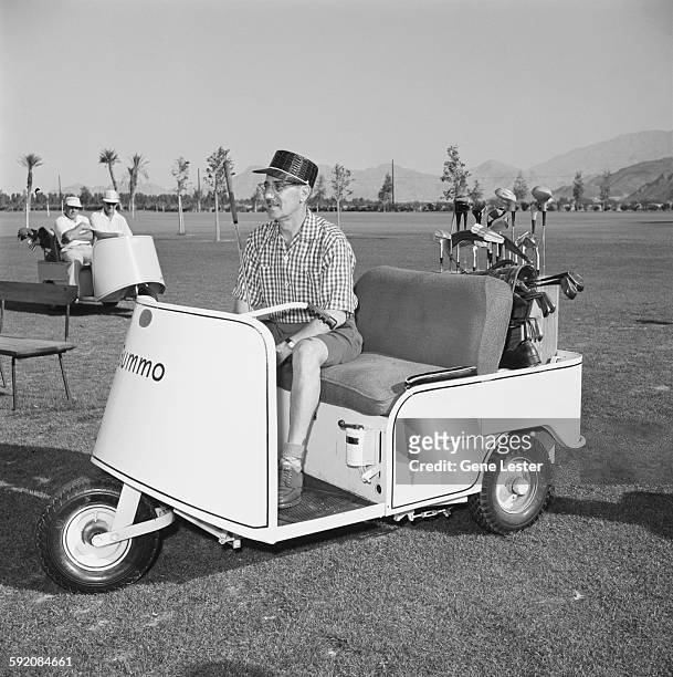 American comedian and actor Groucho Marx rides in a golf cart on a golf course, Palm Springs, California, early 1954.