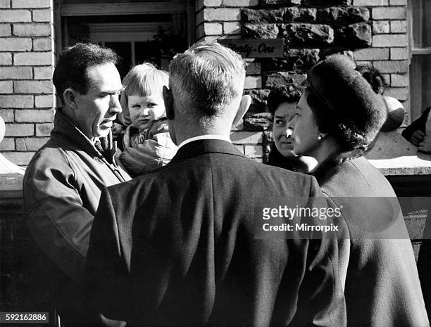 Her Majesty Queen Elizabeth II listens to a father recalling the day that brought desolation to Aberfan following the tragic landslide. October 1966