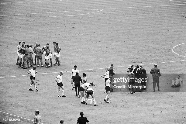 England 4 v West Germany 2, after extra time. England manager Alf Ramsey tries to lift the spirits of his players as they take refreshement in the...