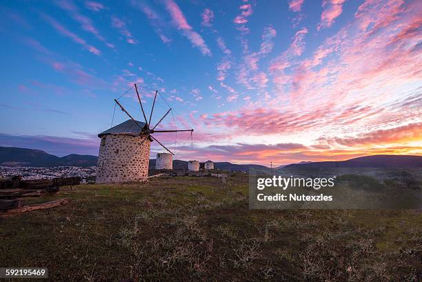 windmills with sunrise sky in bodrum - bodrum turkey stock pictures, royalty-free photos & images