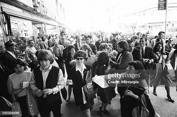 The Rolling Stones on Broadway. Brian Jones and Bill Wyman signing autographs. 2nd June 1964.