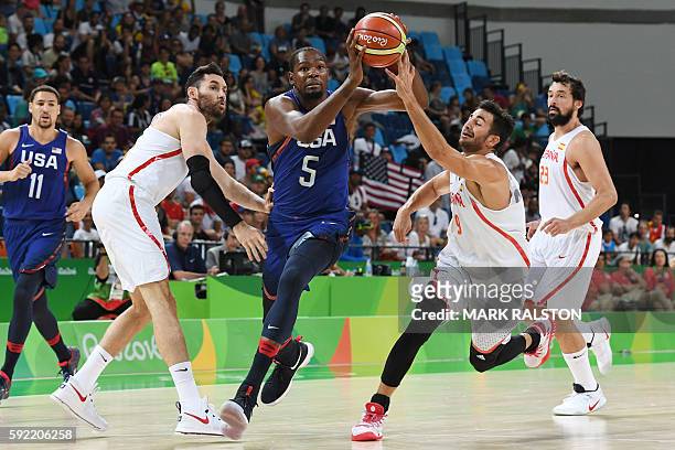 S guard Kevin Durant runs to the basket by Spain's point guard Ricky Rubio during a Men's semifinal basketball match between Spain and USA at the...