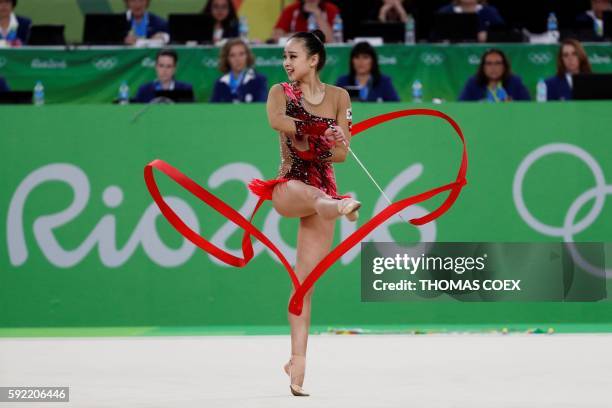 South Korea's Son Yeon Jae competes in the individual all-around qualifying event of the Rhythmic Gymnastics at the Olympic Arena during the Rio 2016...