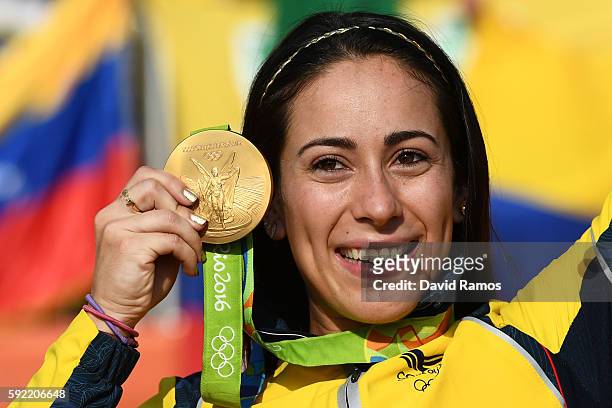 Mariana Pajon of Colombia celebrates with the gold after winning the Women's BMX Final on day 14 of the Rio 2016 Olympic Games at the Olympic BMX...