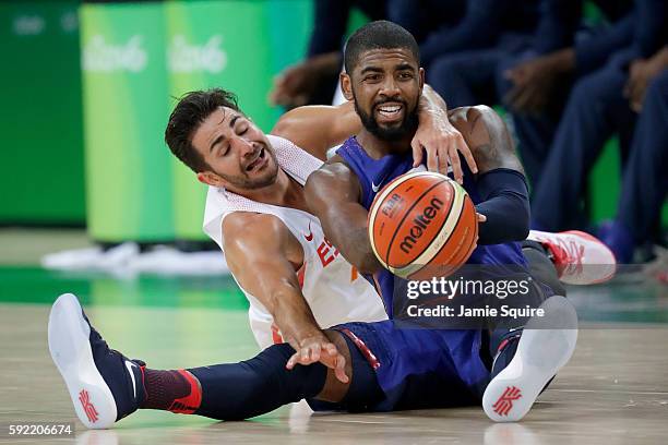 Kyrie Irving of United States goes for the loose ball against Ricky Rubio of Spain during the Men's Semifinal match on Day 14 of the Rio 2016 Olympic...