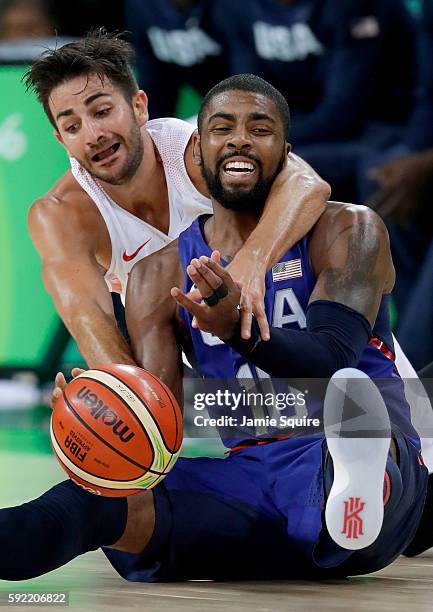 Kyrie Irving of United States goes for the loose ball against Ricky Rubio of Spain during the Men's Semifinal match on Day 14 of the Rio 2016 Olympic...