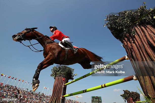 Steve Guerdat of Switzerland riding Nino Des Buissonnets competes during the Equestrian Jumping Individual Final Round on Day 14 of the Rio 2016...