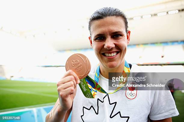 Captain and winning goalscorer Christine Sinclair of Canada celebrates with her medal following her teams victory during the Women's Olympic Football...
