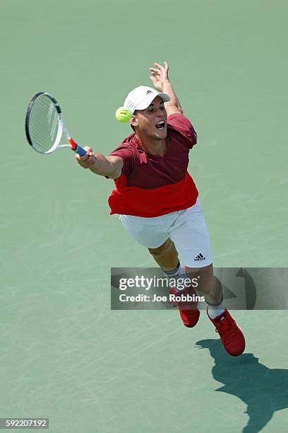 Dominic Thiem of Austria reaches but is unable to get to a serve from Milos Raonic of Canada during a quarterfinal match on Day 7 of the Western &...