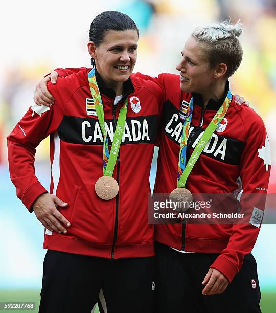 Captain and winning goalscorer Christine Sinclair of Canada celebrates with Sophie Schmidt of Canada following their teams victory during the Women's...