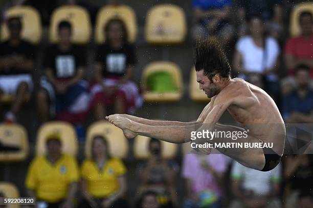 Canada's Maxim Bouchard takes part in the Men's 10m Platform Preliminary during the diving event at the Rio 2016 Olympic Games at the Maria Lenk...