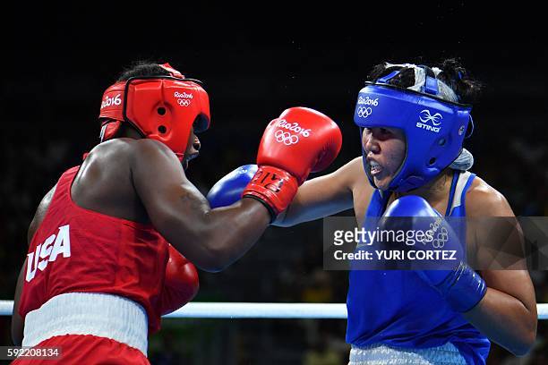 S Claressa Maria Shields fights Kazakhstan's Dariga Shakimova during the Women's Middle Semifinal 1 at the Rio 2016 Olympic Games at the Riocentro -...