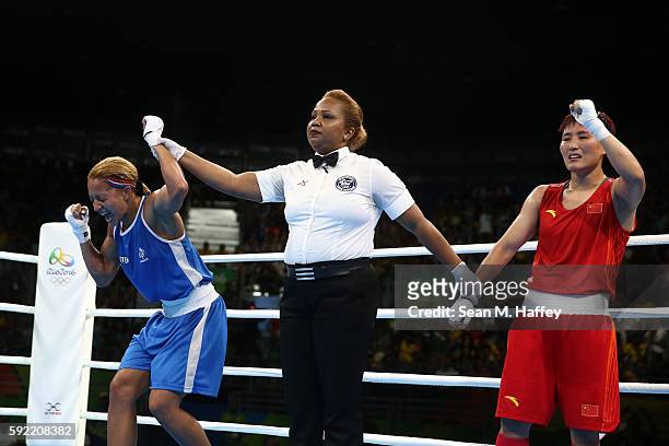 Estelle Mossely of France reacts after defeating Junhua Yin of China in the Women's Light Final Bout on Day 14 of the Rio 2016 Olympic Games at the...