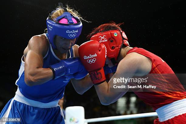 Estelle Mossely of France fights Junhua Yin of China in the Women's Light Final Bout on Day 14 of the Rio 2016 Olympic Games at the Riocentro arena...